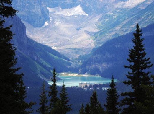 Image of Lake Louise in Canada  showing the whier glacier above that feeds the lake.